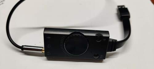 A commercial USB
                sound card with one 3.5mm audio cable plugged into the output
